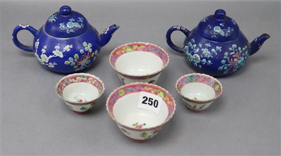 A pair of Chinese Straits teapots and four teabowls